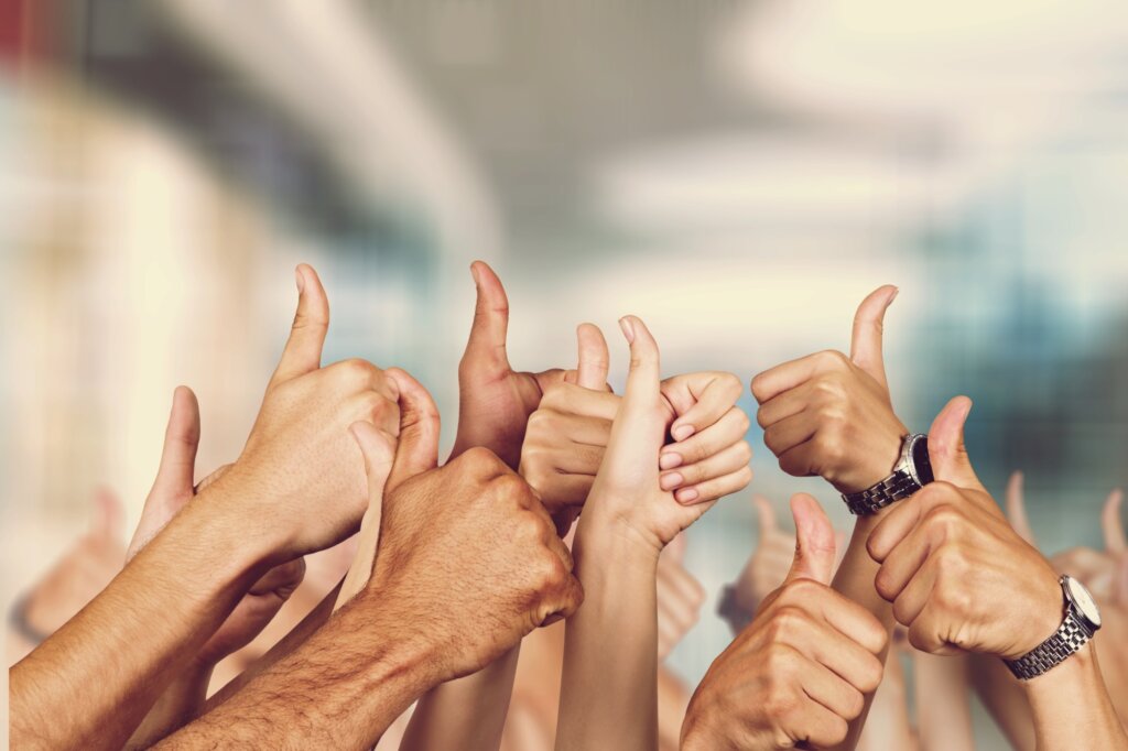 Group of hands with thumbs up